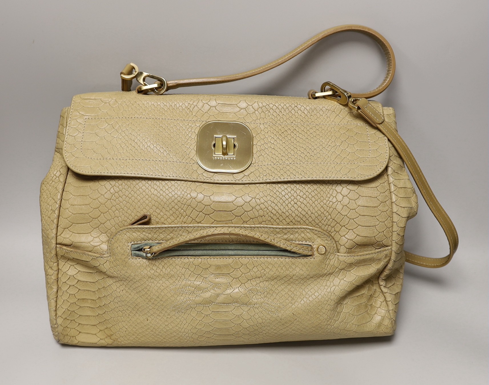 A buffalo tan leather Longchamp Women’s bag, together with a white leather Salvatore Ferragamo Women's shoulder bag. Both with original dust bags